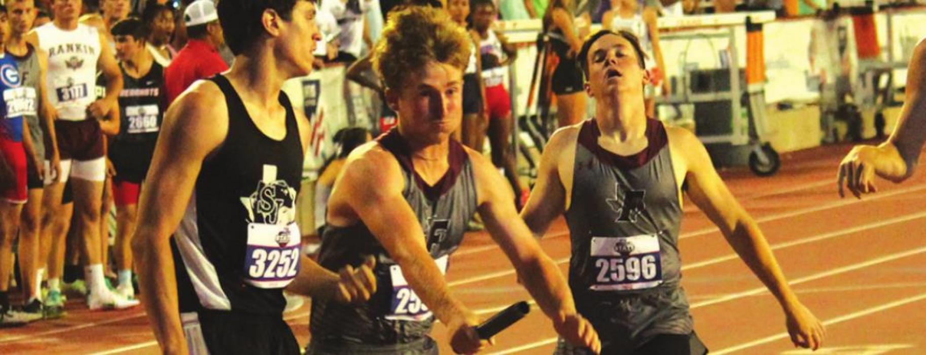 Reid Gross hands off to Logan Fritsch at Fayetteville’s first exchange of the 1A boys 4x400 relay. Fayetteville placed fifth with a school record time of 3:31.23. Photo by Jeff Wick