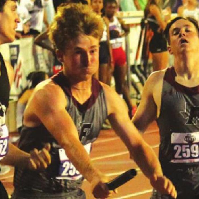Reid Gross hands off to Logan Fritsch at Fayetteville’s first exchange of the 1A boys 4x400 relay. Fayetteville placed fifth with a school record time of 3:31.23. Photo by Jeff Wick