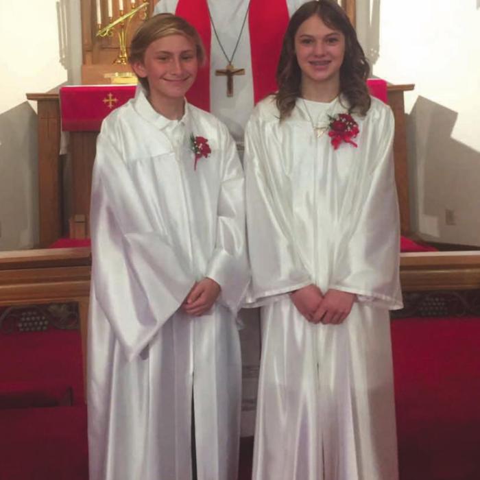 Confirmands Andrew Blake Davis and Ashton Michelle Grimm shown with Pastor Beck.