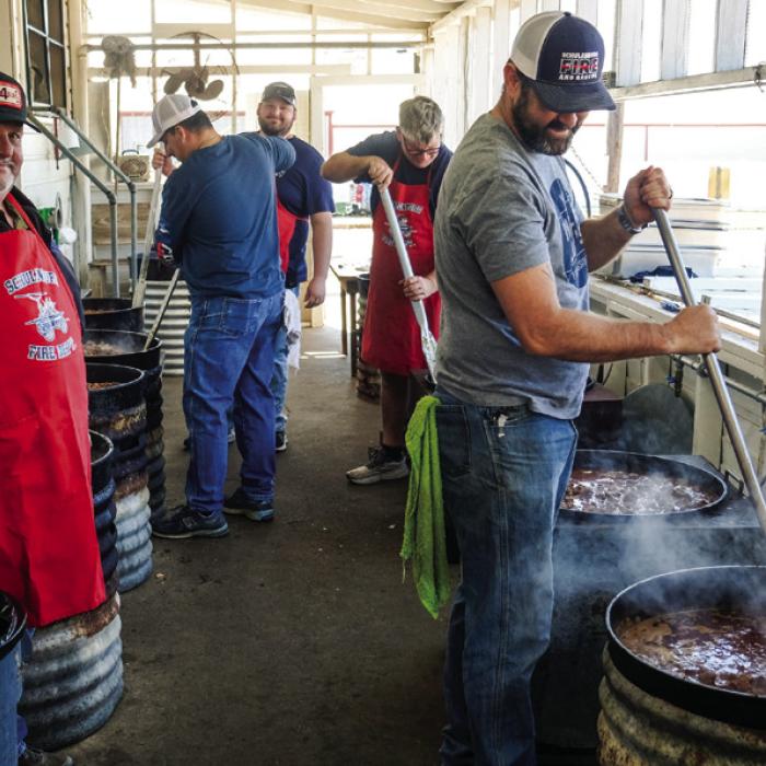 Schulenburg volunteer firefighters tend to their steaming kettles of beef stew for the Firemen’s Benefit Supper at the Schulenburg KC Hall Thursday. Pictured (from left) are firemen Darren Florus, Asst. Chief Gary Eudy, Brayson Florus, Frank Wick III, and Jarred Willbanks. Photo by Andy Behlen