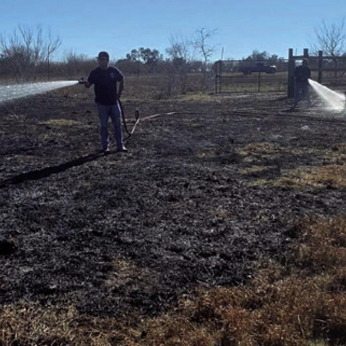 A few of the Schulenburg firemen had to leave the KC Hall on Thursday to put out a small grass fire north of town. Photo courtesy of the Schulenburg VFD