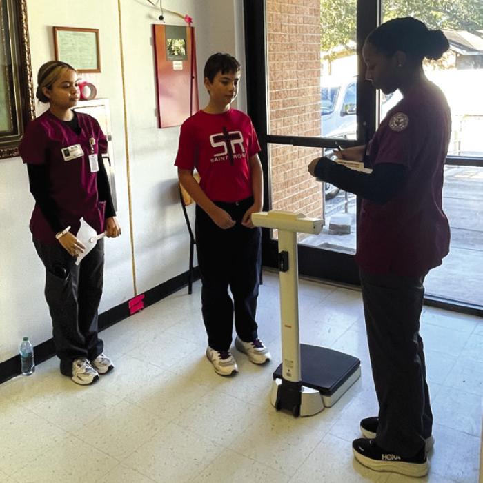 Victoria College Zelda L. Allen School of Nursing LVN Program nursing students (from left) Marcedes Martinez, Karsen Lacina with a St. Rose student.