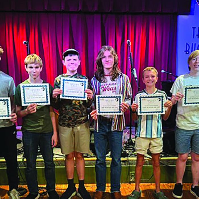 Camp attendees with their certificates of completion.