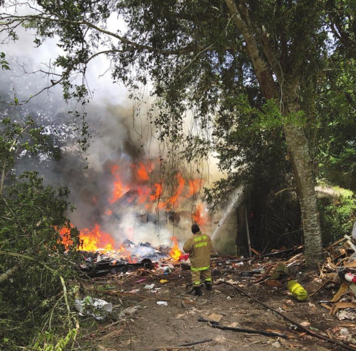 About 30 firefighters from four departments battled a fire on Walhalla Rd. Thursday afternoon.