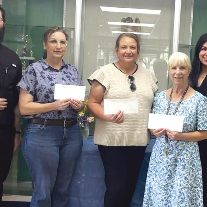 St. Michael Catholic School Teacher Grant from left: Father Chase Goodman; Traci Llanes, Ann Barlow, Sharon Johnson; Melanie Ramirez, SFF Program Director.