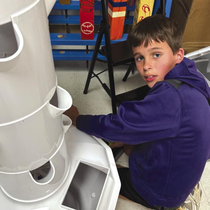 Hayes Kridel spent a day of his spring break helping put together the tower garden that had a spring cleaning.