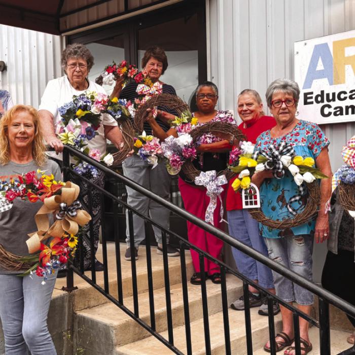 April at Artful Fridays at Arts For Rural Texas reflects the season of spring. Sheryl Tumis is teaching a Floral Design workshop. Her students created these lovely wreaths just in time for Easter. Pictured are Mary Ann Jurica, Jody Driskel, Leona Lange, Delores Bitner, Janice Collins, Annette Jasek, Sheryl Tumis, and Kathy Carpenter.