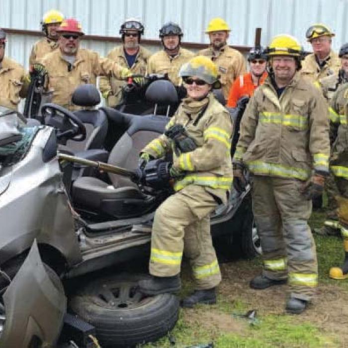 Above: A group working on vehicle extrication techniques and that class in action (right).