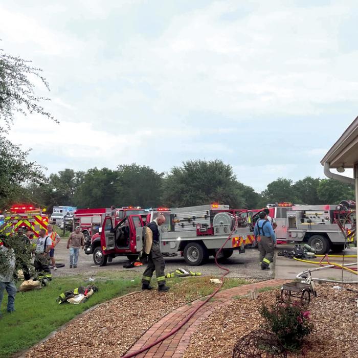 The Schulenburg Volunteer Fire Department saved a house that caught fire east of Schulenburg Tuesday afternoon. The home suffered damage, however. A benefit fund has been set up at Fayette Savings Bank to assist homeowner Judy Kubenka with repairs. Photo courtesy of the Schulenburg Volunteer Fire Department