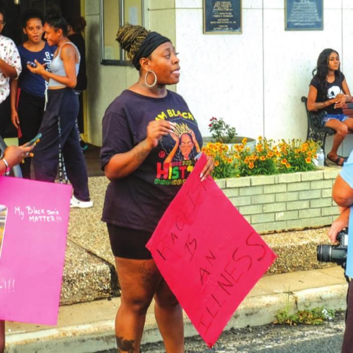 Protester Charity Williams speaks with Darryl Vyvjala of the Schulenburg Sticker newspaper at the Black Lives Matter demonstration in Schulenburg Wednesday evening, June 3. Photo by Andy Behlen