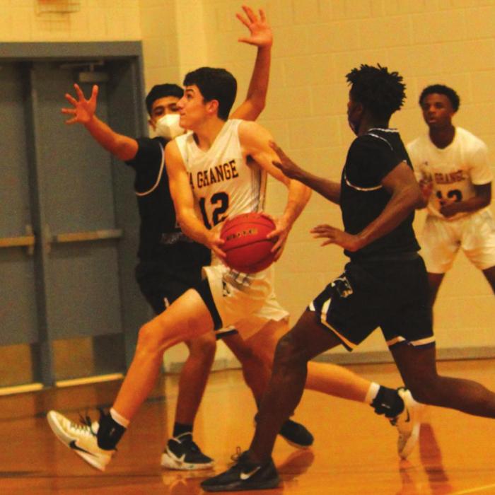 La Grange’s Caden Cooper drives to the basket.