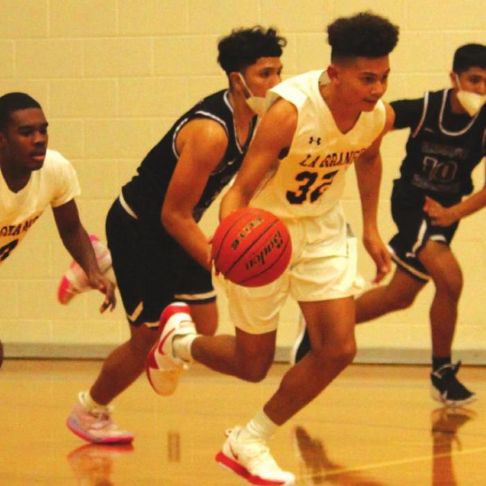 Varsity newcomer Nate Scott leads a fast break.