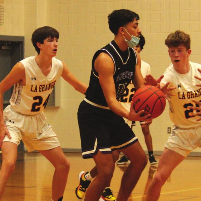 La Grange’s Jaxon Cooper and Eli Roberts on defense during Tuesday’s game.