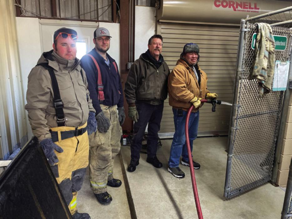 La Grange firefighters helped clean the kennels at the animal shelter Monday and Tuesday after freezing weather froze the pipes. Photo by Andy Behlen