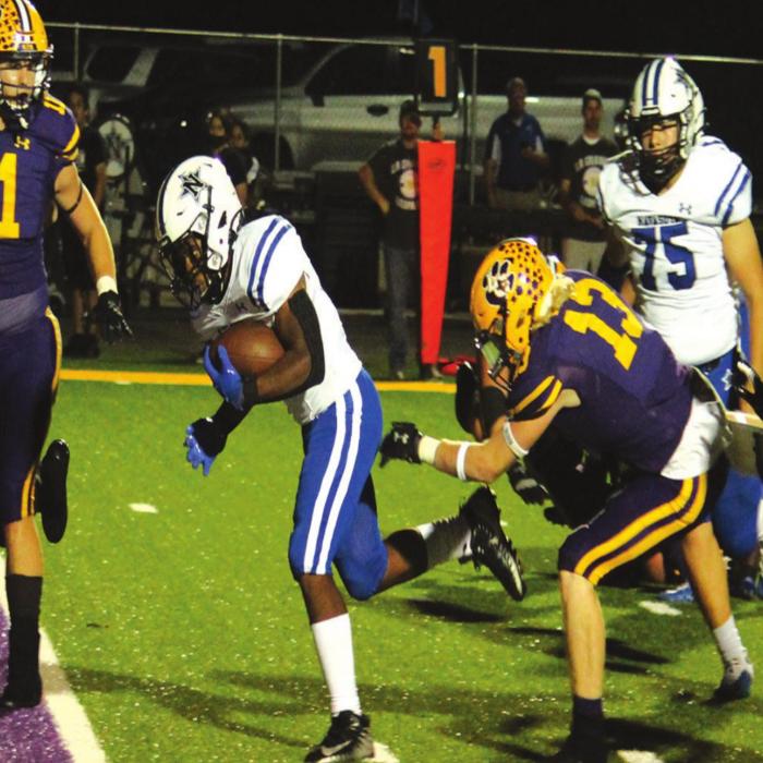 Navasota’s Jamall Thomas scores one of his two touchdowns Friday as La Grange’s Andrew Faske (11) and Justin Lewis (13) converge on the play. Photo by Jeff Wic