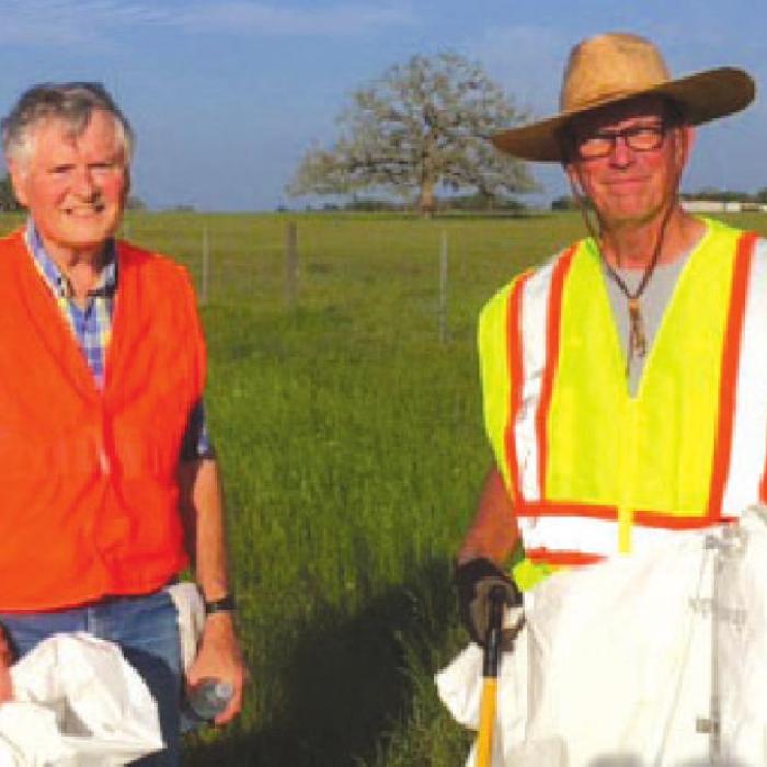 Jim Sula and Joe Lamer picking up trash along Hwy. 159.