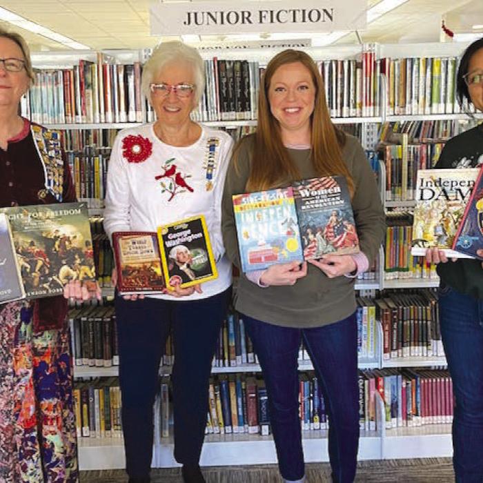 From left: Kim Joost, Smith-McMillan Chapter Librarian; Carolyn Caflisch, Smith-McMillan Chapter Regent; Allison MacKenzie Hollek, Fayette Public Library (La Grange) Director; Carol Perales, Fayette Public Library Youth Services Coordinator.