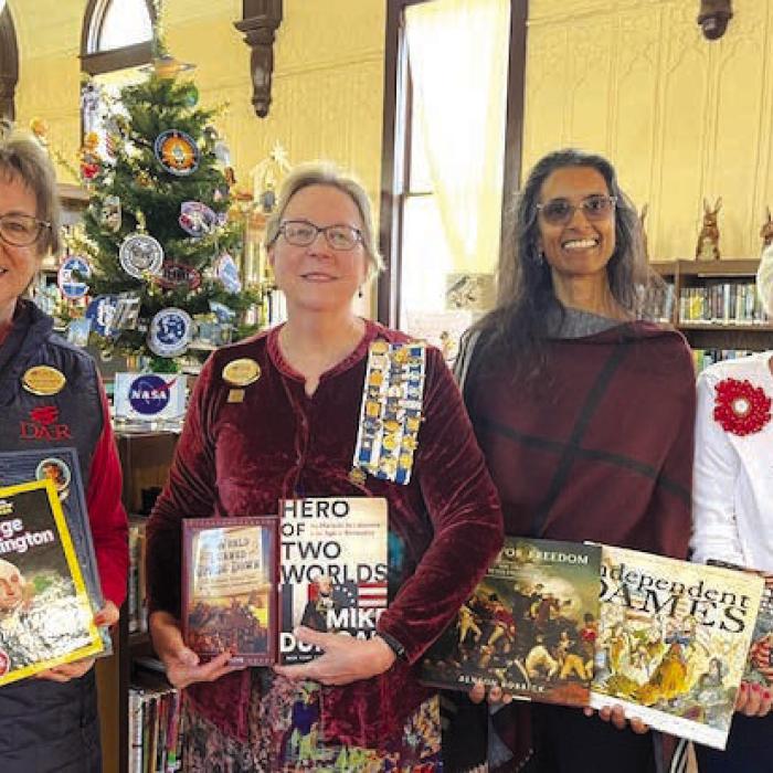 From left: Kathy Schatte, DAR member; Kim Joost, Smith-McMillan Chapter Librarian; Keelia Ritch, Round Top Family Library Manager; Carolyn Caflisch, Smith-McMillan Chapter Regent.