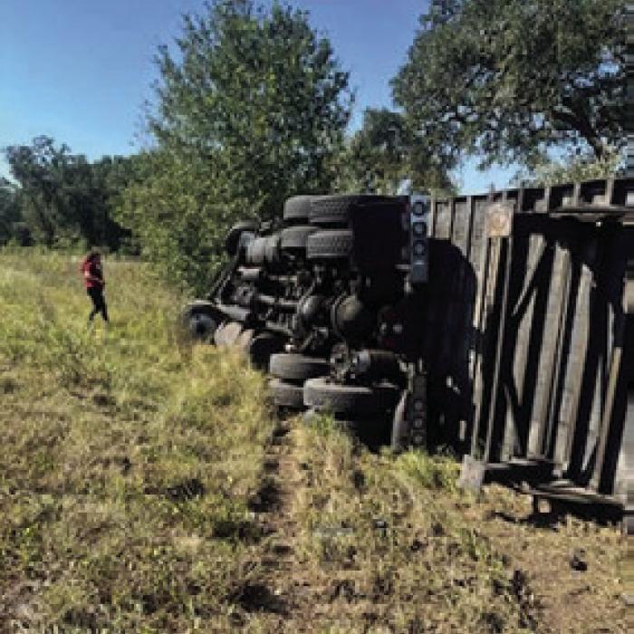 An 18-wheeler rolled on its side after swerving to avoid a head-on collision on SH 237 near Hills Rd. last Tuesday.
