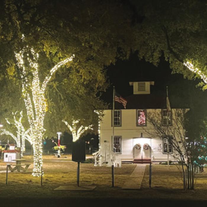 A day full of Christmas events in downtown Round Top Saturday culminated with a stunning lighted Christmas parade. Above is one of the floats, a life-sized snowglobe with folks inside. The bottom photo shows the lighted town square after the crowds had left. Photos by Jeff Wick