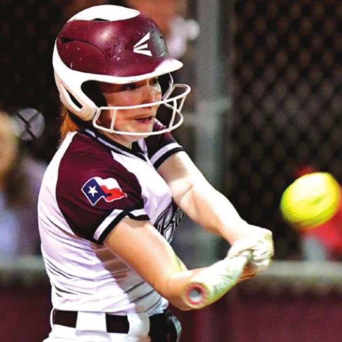 Laurel Betak comes to the plate in the bottom of the 7th inning to knock one over the fence to pull ahead of Schulenburg for the win. Photo by Stephanie Steihauser