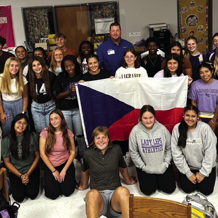 The high school Leo club members with Texas Czech Heritage and Cultural Center manager Mark Hermes during his visit to the school.