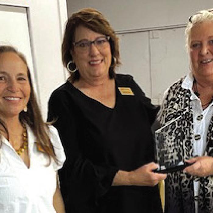 Melba Zingelmann (pictured far right) was named the Citizen of the Year at the Carmine Chamber of Commerce Mixer on Feb. 27. Presenting the award is Marlene Waak. Also pictured on the left is Courtney Kieke, president of the Chamber.