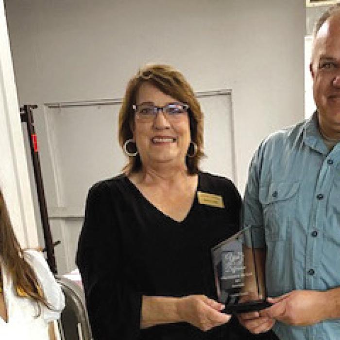 David Kieke was named Volunteer of the Year at the Carmine Chamber of Commerce Mixer on Feb. 27. Pictured from left to right are Courtney Kieke, president of the Chamber, Marlene Waak, and David Kieke.