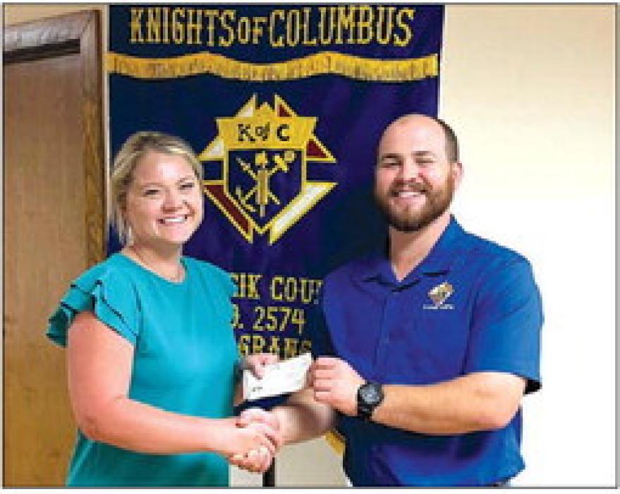 Receiving a Knights of Columbus Scholarship in honor of Knights of Columbus Council No. 2574 members is Alyson Trlicek.