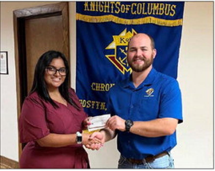 Receiving a Knights of Columbus Scholarship in honor of Knights of Columbus Council No. 2574 members is Alessandra Solorzano.