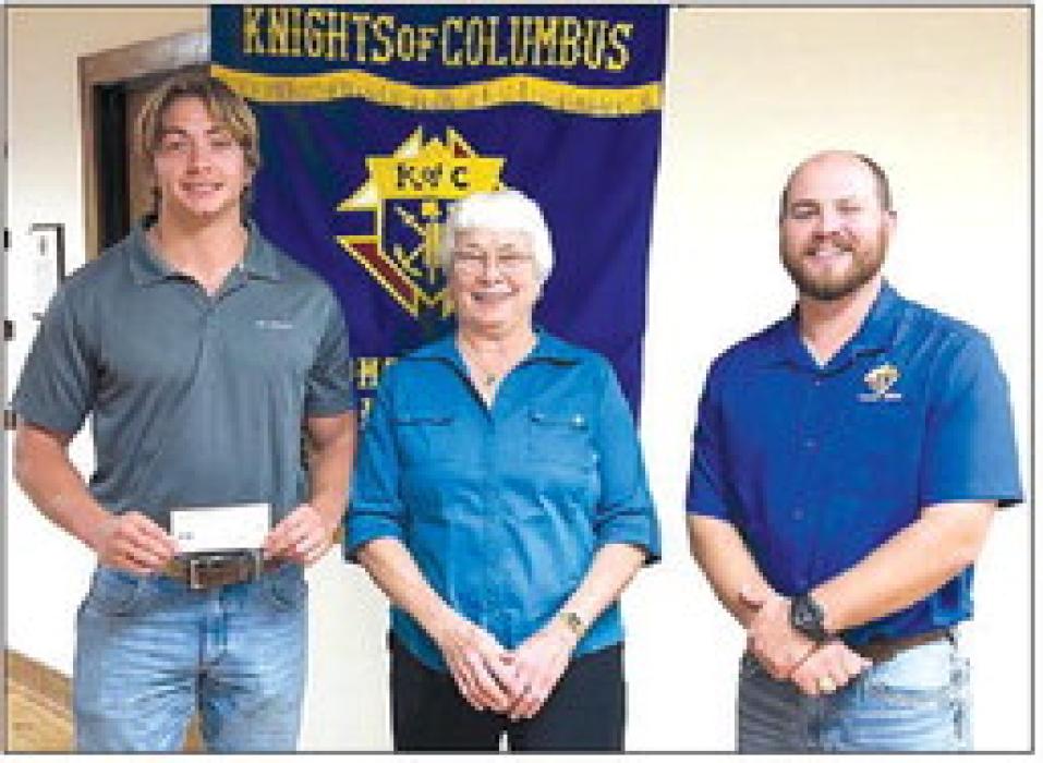 Receiving a Knights of Columbus Scholarship in honor of deceased member and spouse, Jerry and Annie Kallus, is Justin Faldyn.
