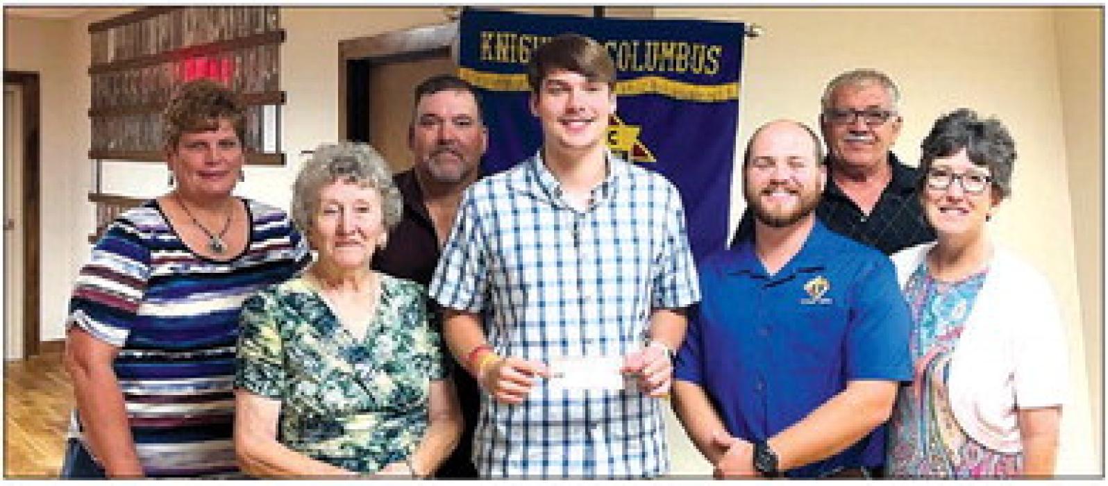 Receiving a Knights of Columbus Scholarship in honor of deceased member Arnold Janda is Zachary Janda.
