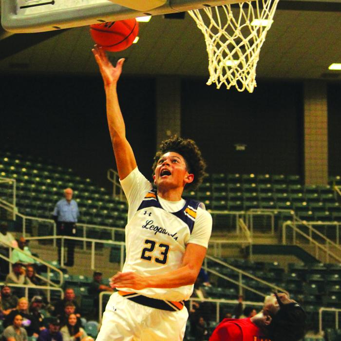 Nate Scott drives to the basket Monday.