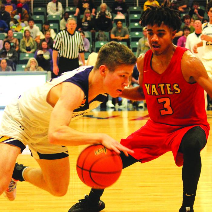 La Grange’s Clayton Knapik drives to the basket against the defense of Yates in Monday’s game. Photos by Jeff Wick