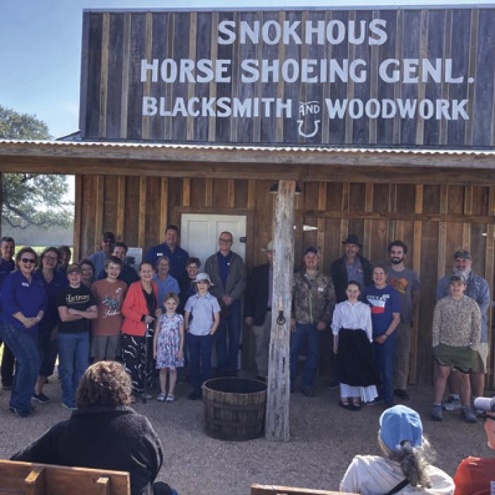 Folks instrumental in making the new blacksmith shop a reality gathered for a group photo at the Feb. 21 event.