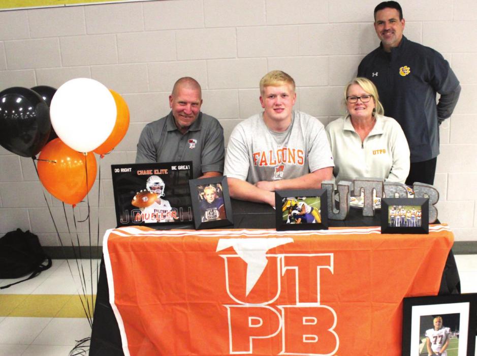 La Grange High School football star Joseph Mueller signed his paperwork last week to play college football for the University of Texas Permian Basin. He is shown above at his signing ceremony Friday. Joseph is seated, center, between his parents Doug and Lisa Mueller. Standing is La Grange football coach Matt Kates. UT-Permian Basin is an NCAA Division II school that competes in the Lone Star conference. Photos by Jeff Wick