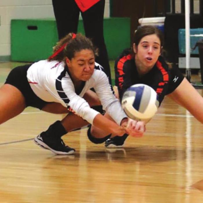 Schulenburg’s Kieryn Adams (left) and Claire Antosh (right) both make sure this hit from Thrall doesn’t hit the floor in Saturday’s regional final. Photo by Audrey Kristynik
