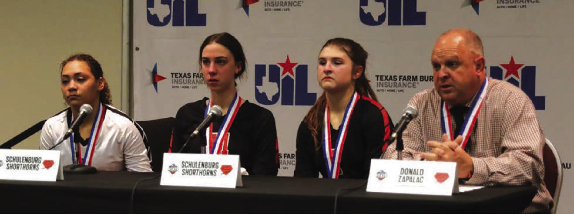 Left to right: Schulenburg’s Kieryn Adams, Meredith Magliolo, Landry Zapalac and head coach Donald Zapalac answer questions in the press conference after the state semifinals. Photo by Audrey Kristynik