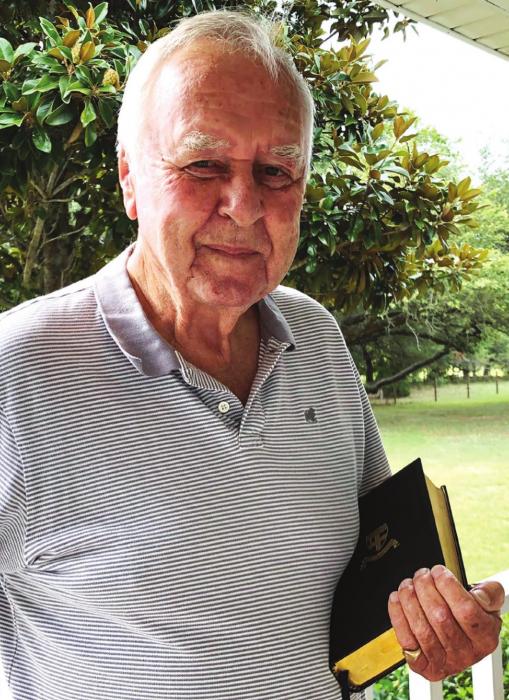 Fayette County’s Richard Dixon, who attended Christ’s Hospital in England, from 1941 to 1948, holds the Bible he received upon leaving the school to go to sea. The boarding school was located in “buzz-bomb alley,” not far from London, which was heavily assaulted by Germany during World War II.