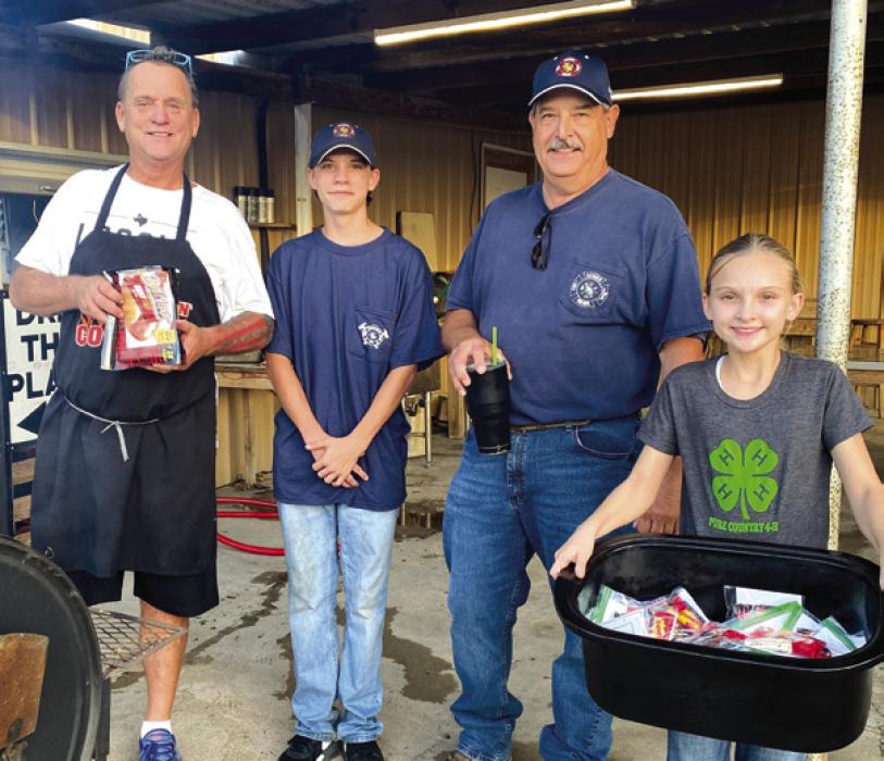 Pictured are Michael Schlabach, Conner King, Bruce Kubena and Brylee Brugger at the first Neighbors Night Out.