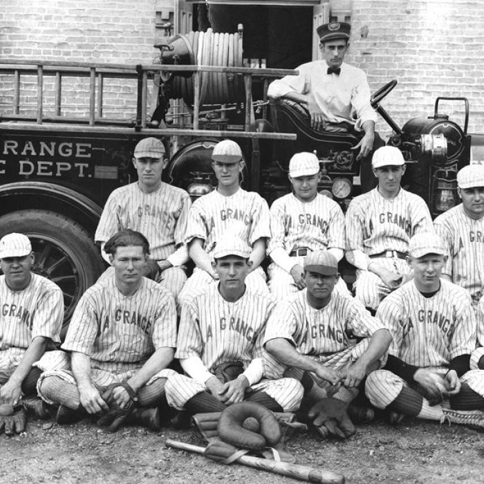 The La Grange Fire Department’s baseball team poses in front of an early fire engine and the Old Casino Hall, which had recently been converted from La Grange High School to a fire station. None of the men have been identified. Photo courtesy of the Fayette Heritage Museum and Archives