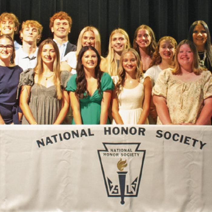 The new and returning members of the La Grange High School Chapter of the The National Honor Society, pose on stage at the conclusion of the Sept, 10 induction ceremony at the school’s Performing Arts Center. Photo by Lucy Carr