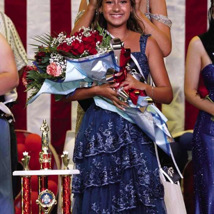 Bebe Pavlica is crowned 2026 Fair Queen Thursday night by 2025 queen Hailey Janish. Photo by Grace-Anne Matocha