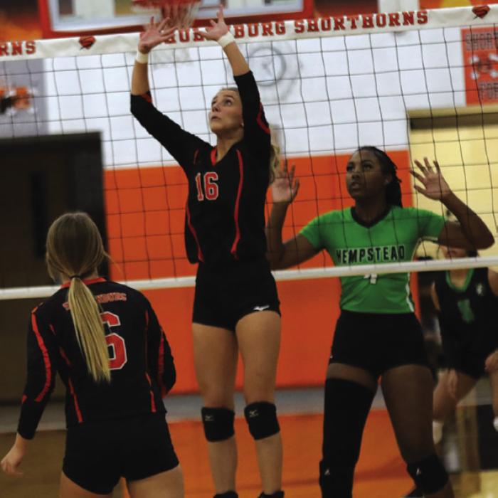 Schulenburg’s Jenna Guentert sets a ball in Friday’s victory over Hempstead. Photo by Audrey Kristynik