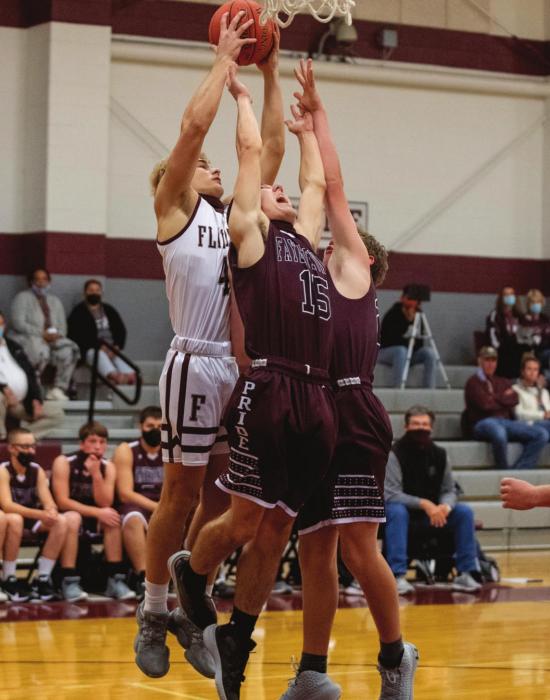 Flatonia’s Holden Kloesel goes up for two in the midst of Fayettville’s defense. Photo by Stephanie Steinhauser