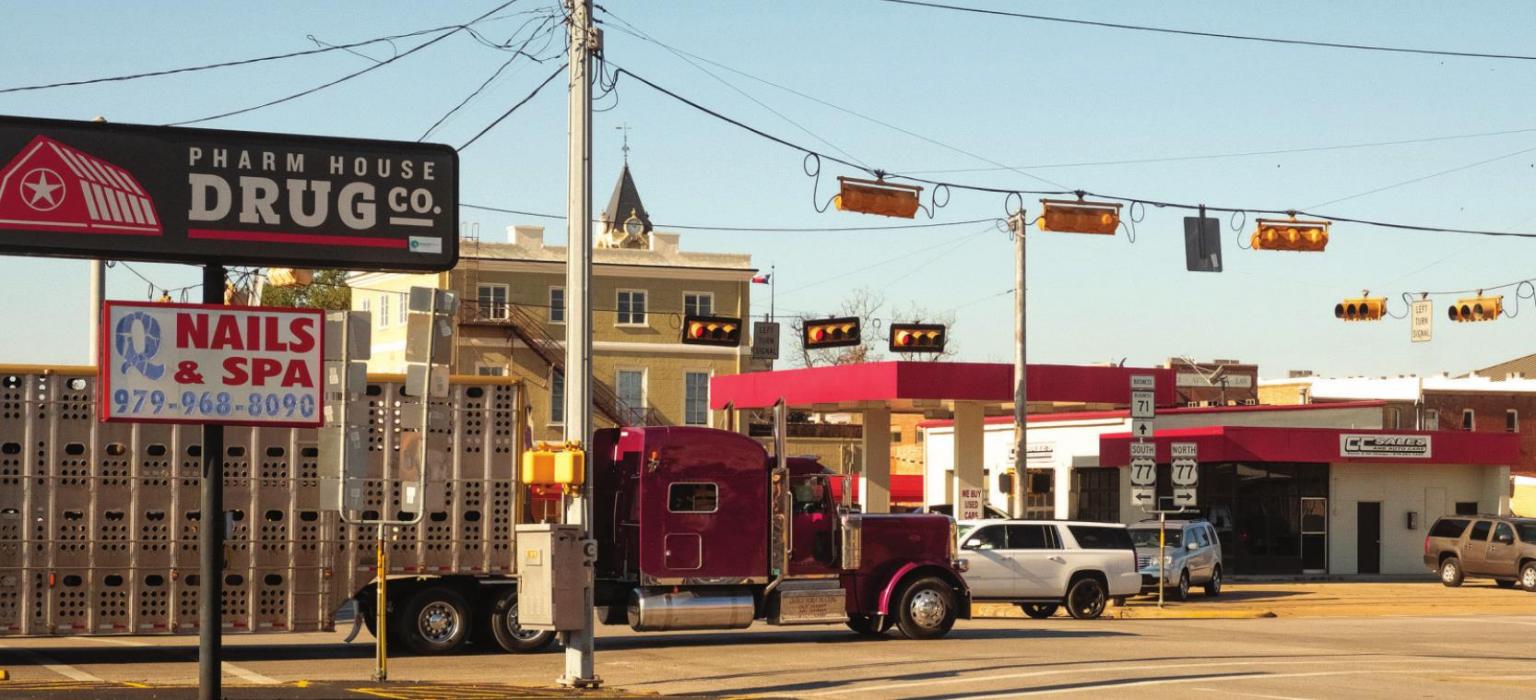 Big trucks have a hard time turning at the intersection of Travis and Jefferson (TX 71 and US 77). Texas Department of Transportation is planning to purchase property to widen the intersection. Photo by Andy Behlen