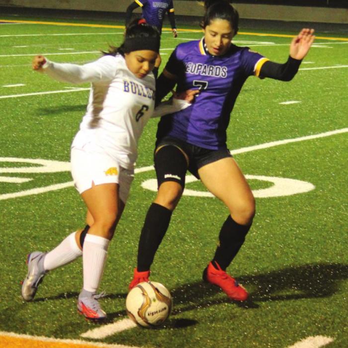La Grange’s Angela Martinez battles an opponent player for control of the ball Friday.