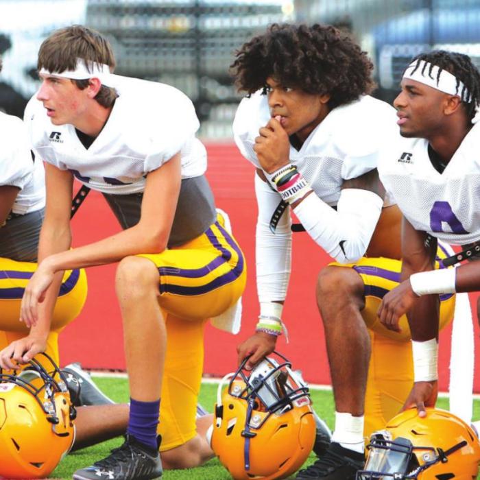 La Grange starters watch the back-ups get some action in the scrimmage.