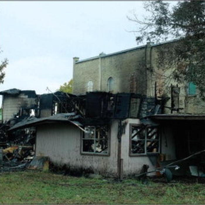 A photo of the aftermath on Tuesday. Notice the burn marks on the building next door.