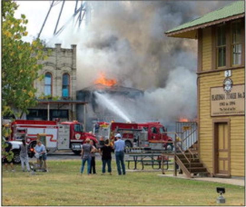 Townspeople gathered downtown on Monday to watch the fire in downtown Flatonia. Photos by Andy Behlen